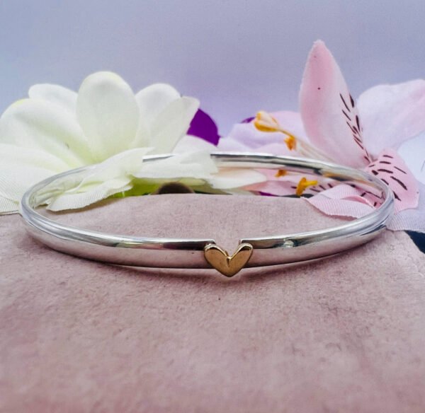 silver bangle with gold heart